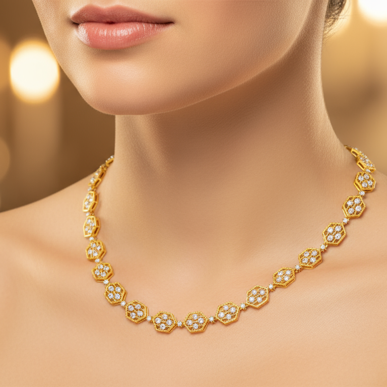 Gold necklace with floral design on a blurred background