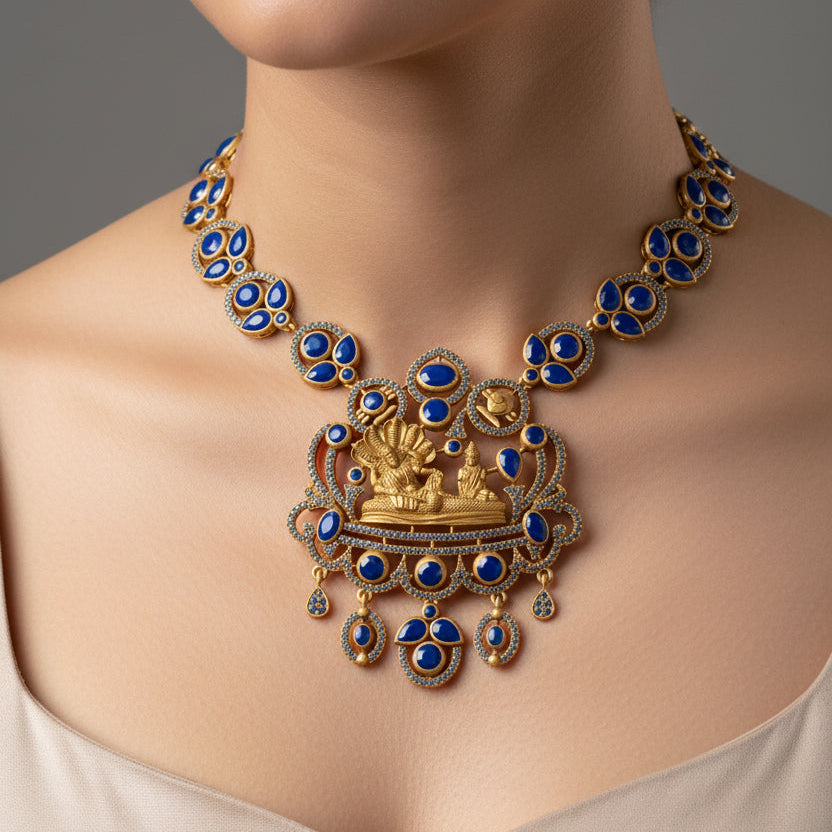 Ornate gold and blue necklace on a mannequin