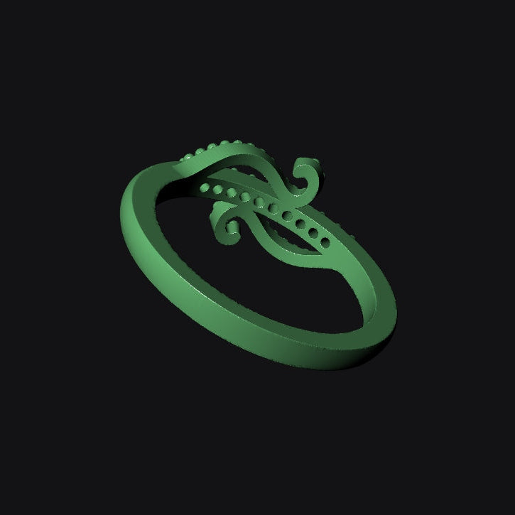 Green alligator-shaped ring on a black background