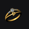 Gold ring with blue gemstones on a black background