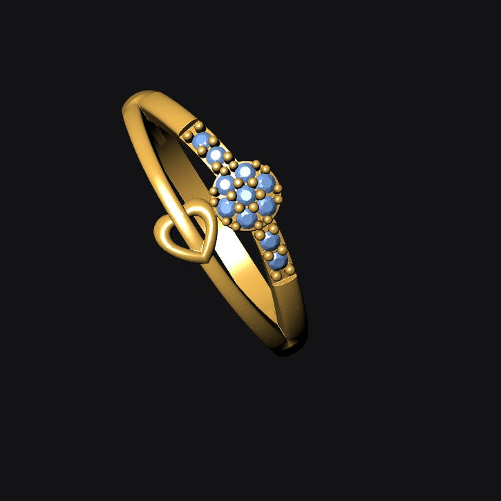 Gold ring with blue gemstones on a black background