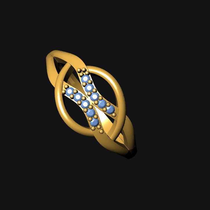 Gold ring with blue gemstones on a black background