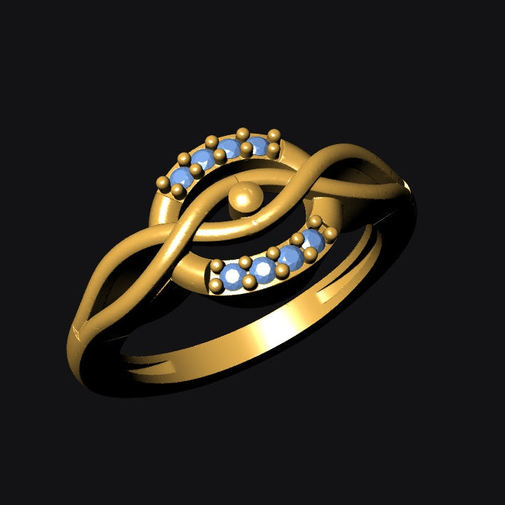 Gold ring with blue gemstones on a black background