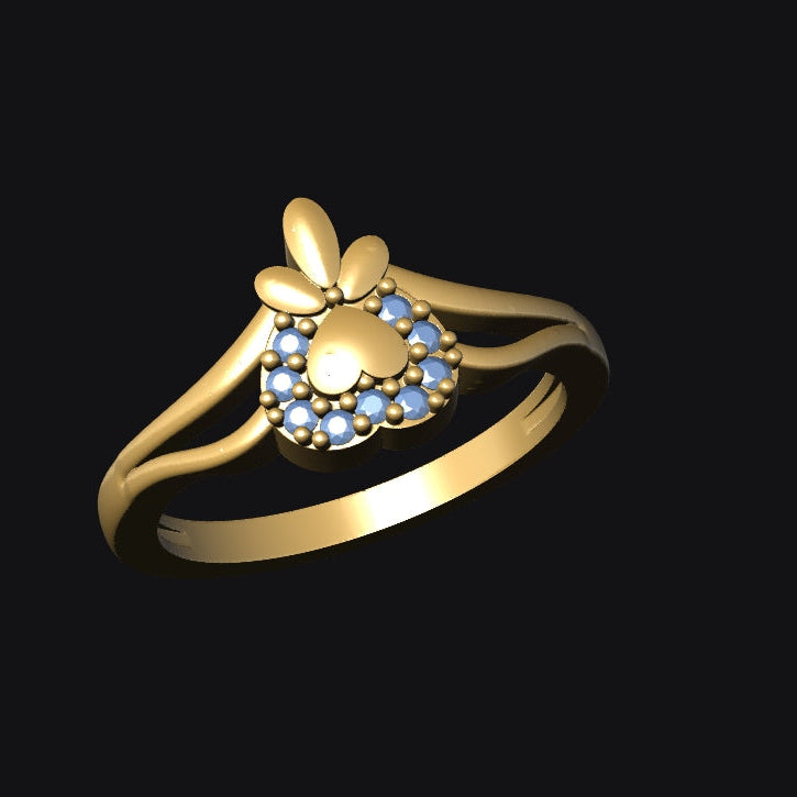 Gold ring with blue gemstones on a black background