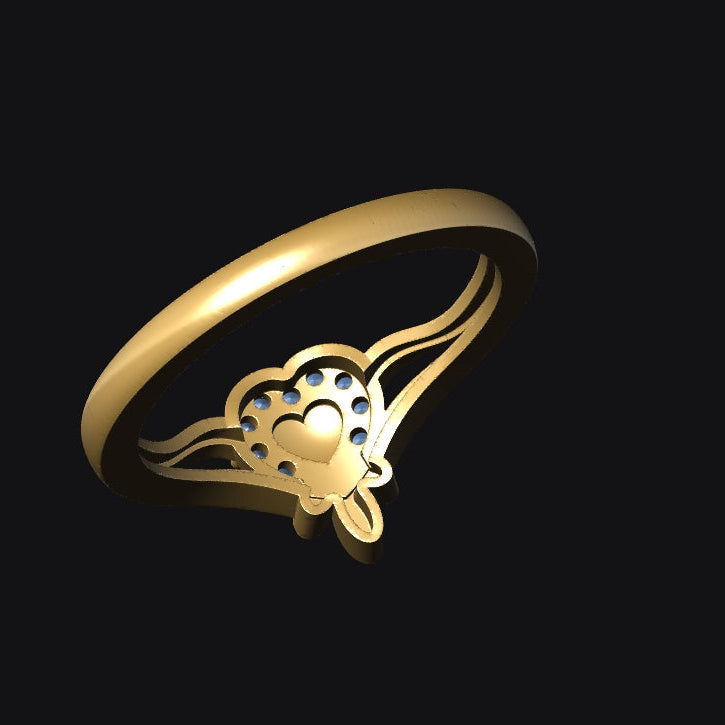 Gold ring with a butterfly design on a black background