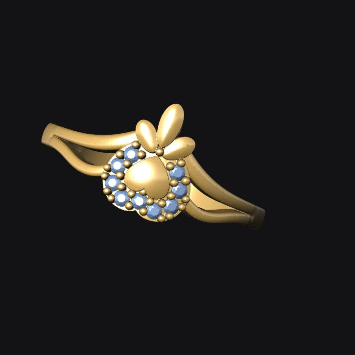Gold ring with a decorative design on a black background