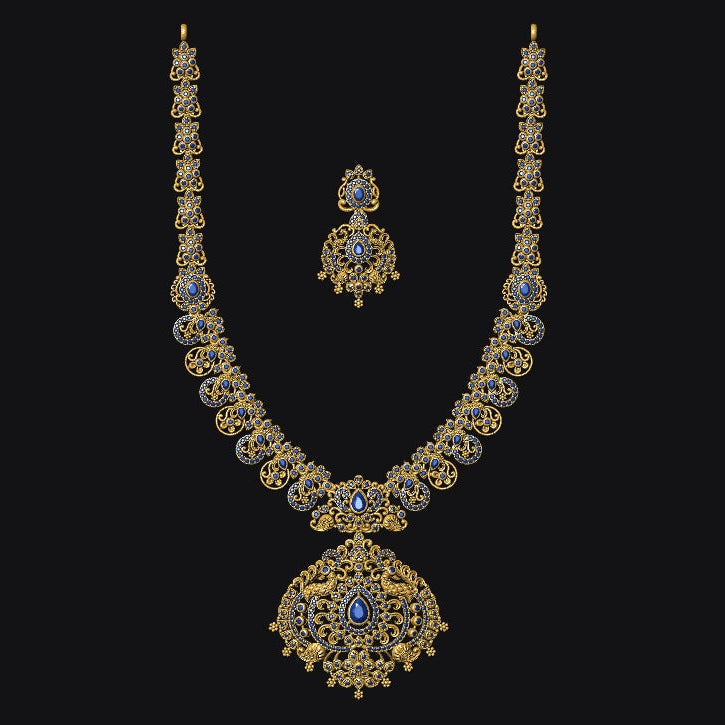 Ornate necklace with matching earrings on a black background