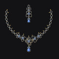 Jewelry set with necklace and earrings featuring blue gemstones on a black background