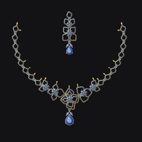 Jewelry set with necklace and earrings featuring blue gemstones on a black background