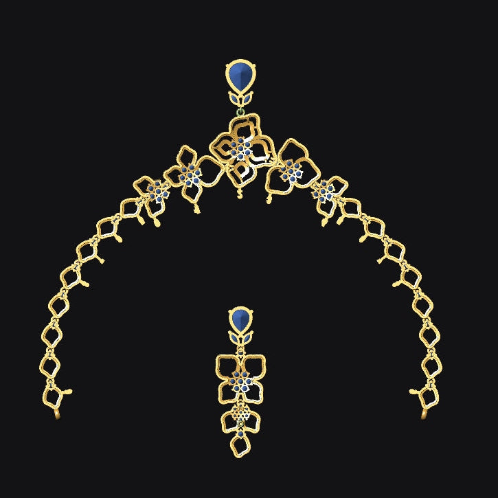Gold necklace with blue gemstones on a black background