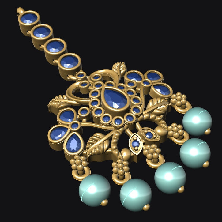 Ornate gold pendant with blue and green gemstones on a black background