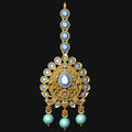 Gold necklace with blue and green gemstones on a black background