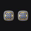 Pair of gold square earrings with blue gemstones on a black background