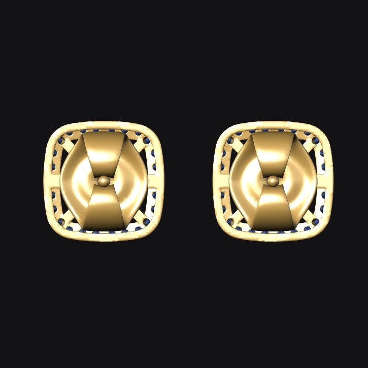 Pair of gold earrings with intricate designs on a black background