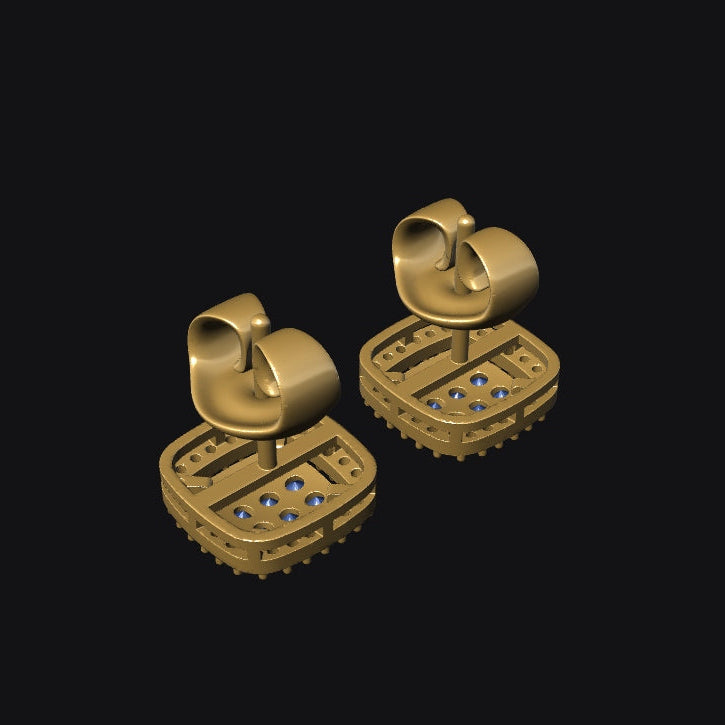 Gold earrings with gemstones on a black background