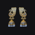 Gold and blue earrings with pearl accents on a black background