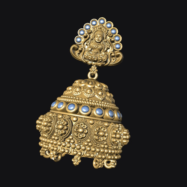 Ornate gold earring with blue gemstones on a black background