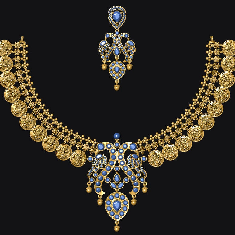 An ornate gold-toned traditional necklace set with matching earrings, featuring circular coin-like motifs along the shoulders and blue stone accents, displayed on a solid black background.