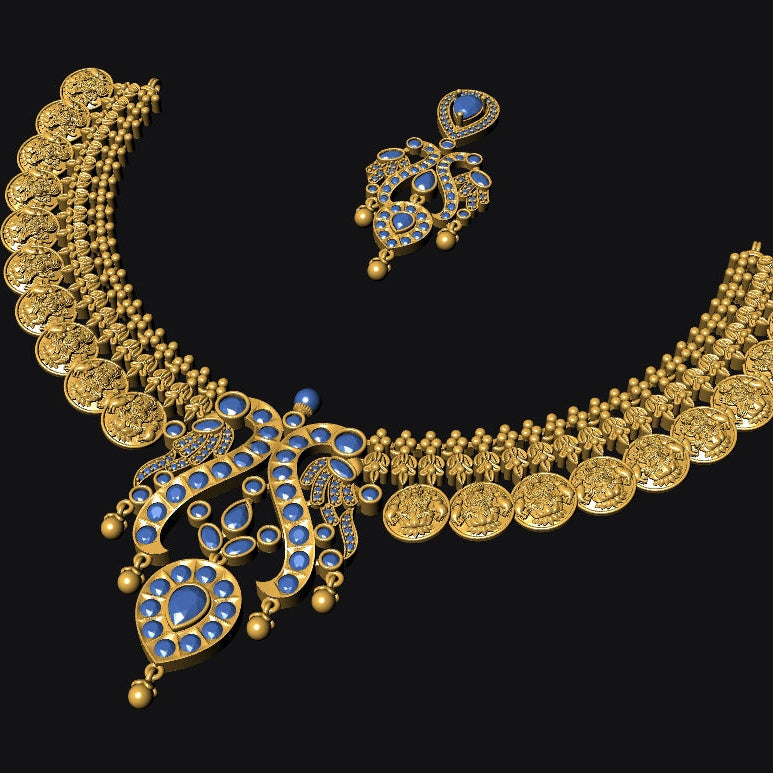 An ornate gold-toned traditional necklace set with a matching pendant and earring, decorated with blue stones, shown on a solid black background.