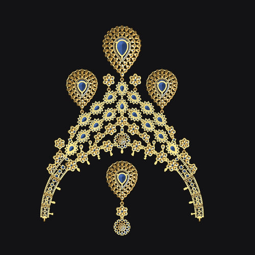 An ornate gold-toned traditional Indian jewelry piece, likely a choker or necklace with matching earrings, featuring intricate filigree work, small blue stones, and a central teardrop-shaped blue stone, set against a solid black background.