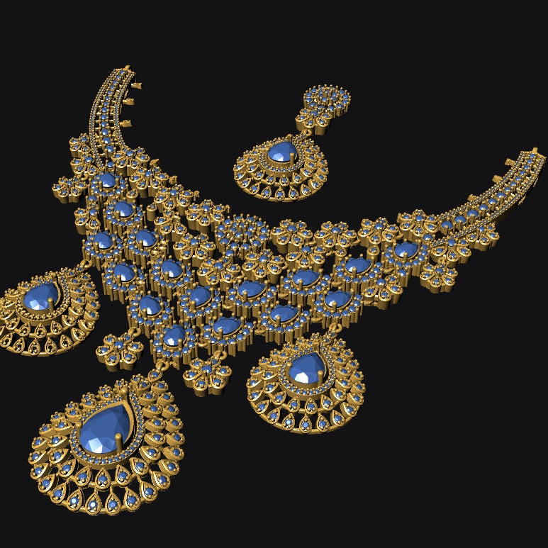 Gold-toned traditional Indian jewelry set featuring a heavily embellished necklace with matching earrings, decorated with gold filigree and blue stones, shown against a solid black background.