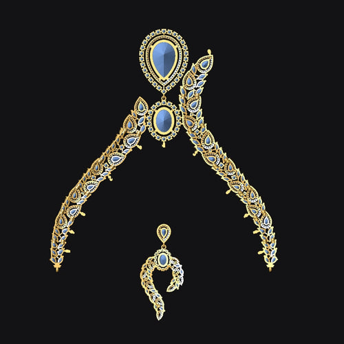 An ornate gold-toned traditional jewelry set featuring a large arched pendant with two curved side elements, a central teardrop-shaped blue stone, and a matching smaller pendant below, shown on a solid black background.