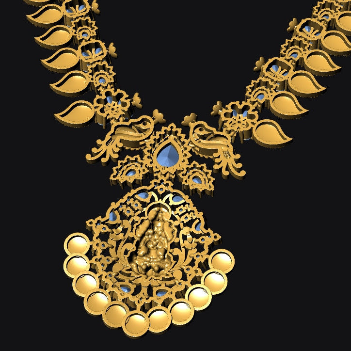 An ornate gold-toned necklace with a large pendant, featuring blue gemstone accents and detailed filigree work, shown against a solid black background.