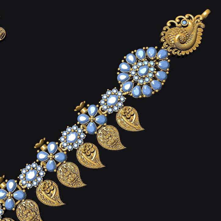 Gold-toned traditional jewelry set featuring a decorative chain with blue and white stone floral motifs and gold leaf-shaped charms, shown on a solid black background with a matching circular piece in the upper left.