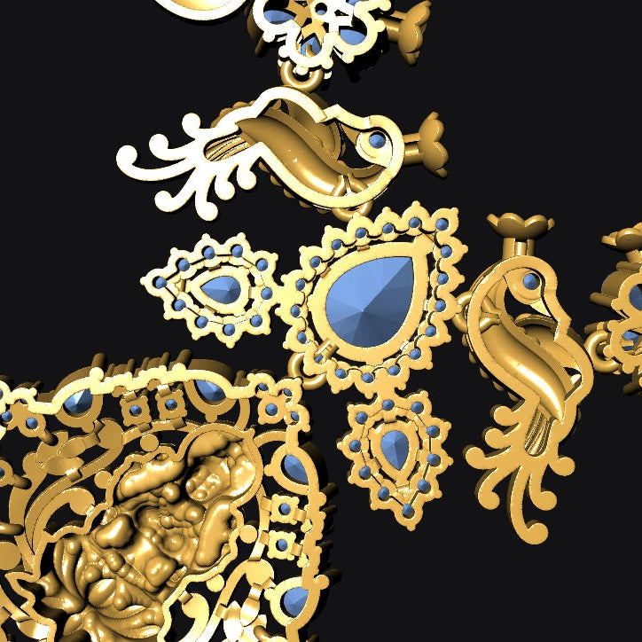 An ornate gold-toned jewelry design featuring peacock motifs, floral filigree, and blue teardrop gemstones on a black background.