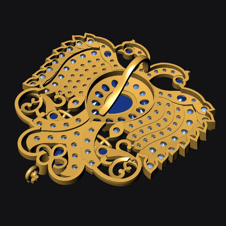 A gold-toned ornate brooch or pendant with a stylized bird motif, featuring blue gemstone-like accents and a central blue oval detail, shown on a solid black background.