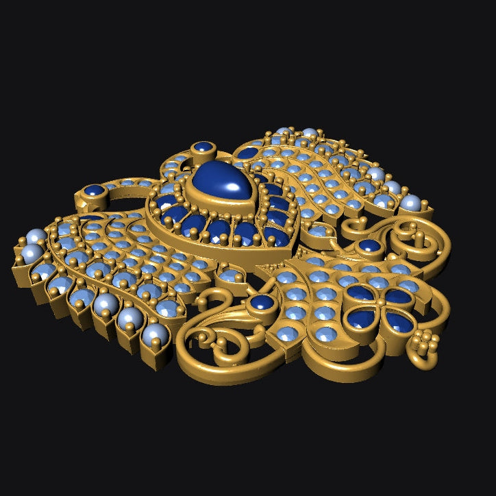 An ornate gold-toned brooch or pendant featuring a central oval blue stone surrounded by rows of round clear stones and smaller blue accents, shown on a solid black background.