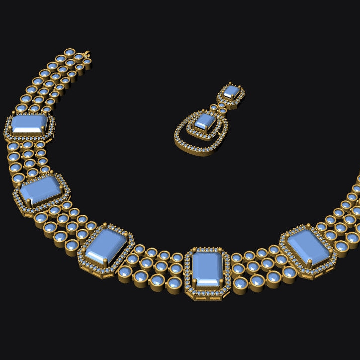 Gold-tone jewelry set featuring a curved statement necklace and matching drop earring, both adorned with light blue rectangular and oval gemstones surrounded by small clear stones, shown on a black background.