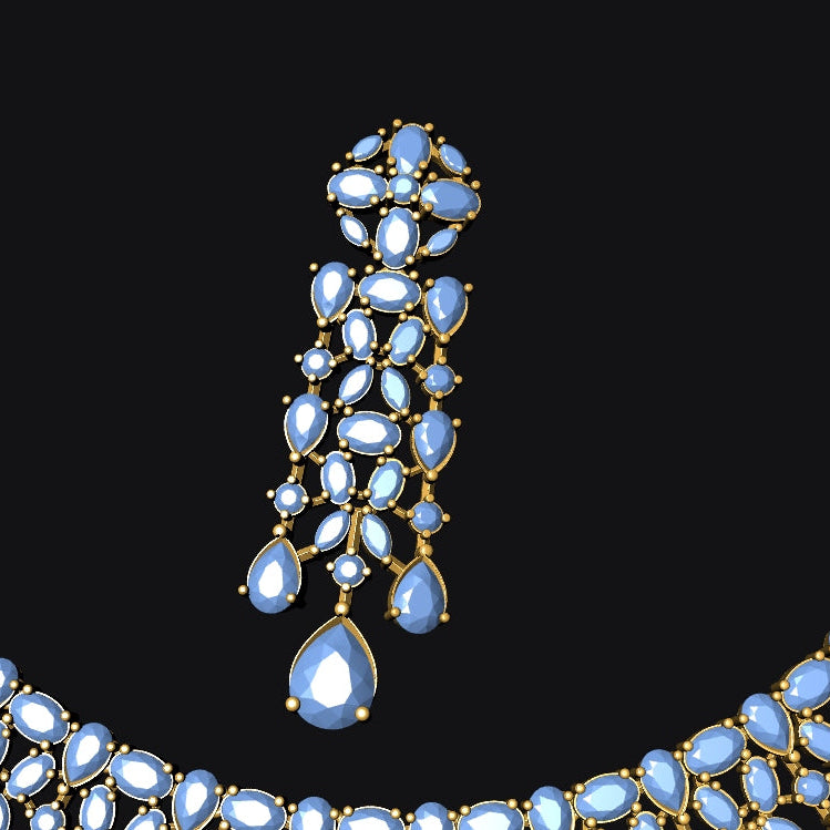 Gold-tone jewelry set featuring a necklace, matching pendant, and earrings, embellished with light blue teardrop-shaped gemstones, shown against a solid black background.