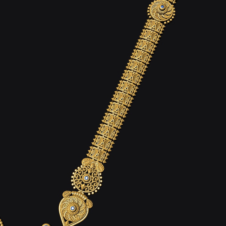 An ornate gold-toned traditional necklace with intricate filigree patterns and small blue stone accents, shown against a solid black background.