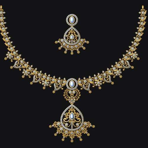 An ornate gold-toned traditional necklace set with a matching pendant and earrings, featuring intricate filigree detailing and white stone accents, displayed against a solid black background.