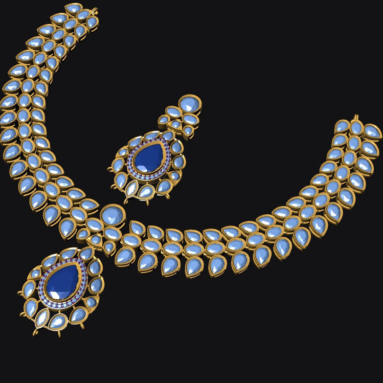 Gold-toned traditional jewelry set featuring a curved necklace and matching earrings, embellished with rows of light blue teardrop-shaped stones and accented with deep blue teardrop center stones, shown on a solid black background.