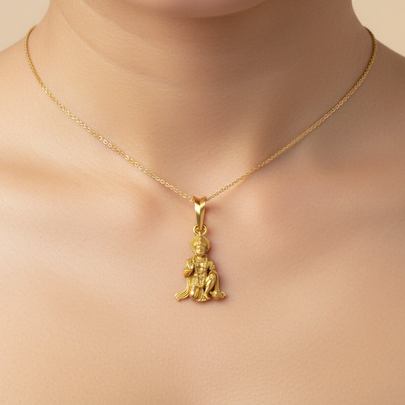 Gold pendant with a figure on a black background