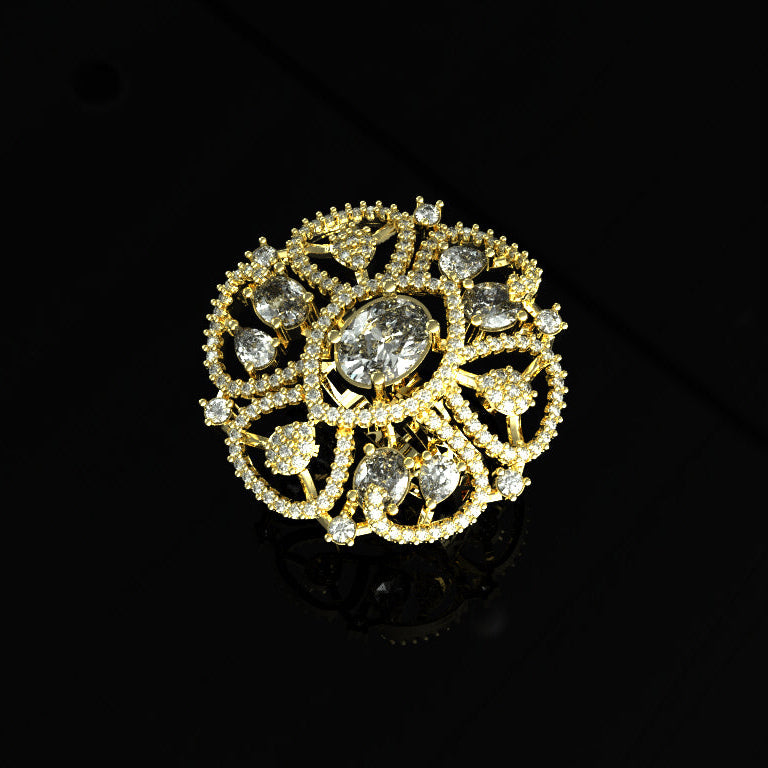 Gold and diamond brooch on a black background